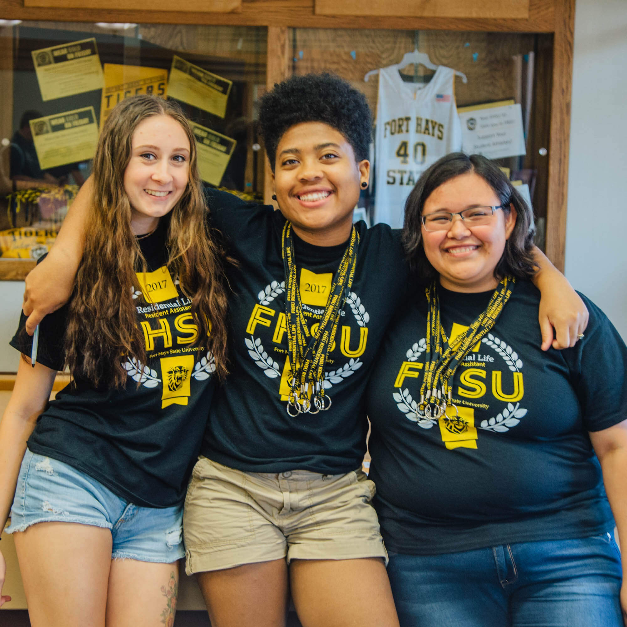 Residential Assistants standing in the Forsyth Library